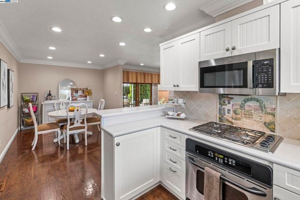 Dining room, Interior, Kitchen, Recessed Lighting, Stainless Steel Appliances, Wood Texture Flooring