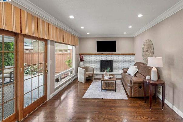 Fireplace, Interior, Living room, Recessed Lighting, Stone Walls, Wood Texture Flooring