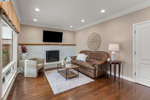 Fireplace, Interior, Living room, Recessed Lighting, Stone Walls, Wood Texture Flooring