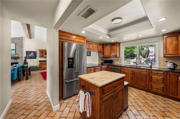 Fireplace, Interior, Kitchen, Recessed Lighting, Stainless Steel Appliances, Stone Walls, Wooden Beams