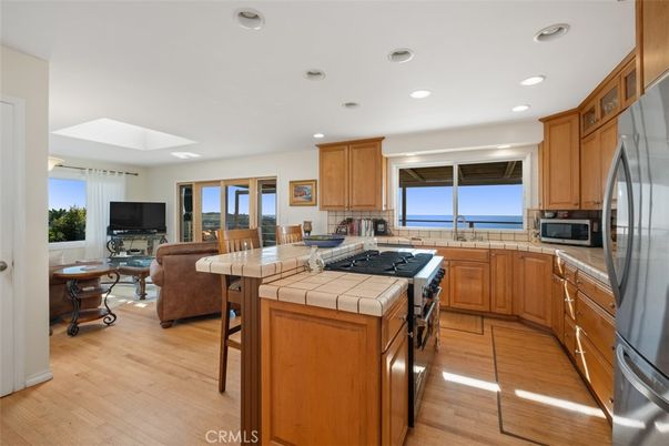 Interior, Kitchen, Living room, Recessed Lighting, Tile Countertops, Water, Wood Texture Flooring