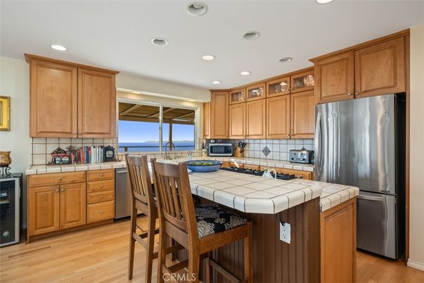 Interior, Kitchen, Recessed Lighting, Tile Countertops, Water, Wood Texture Flooring