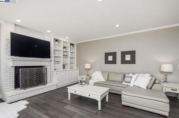 Fireplace, Interior, Living room, Recessed Lighting, Stone Walls, Wood Texture Flooring