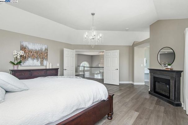 Bedroom, Chandelier, Fireplace, Interior, Wood Texture Flooring