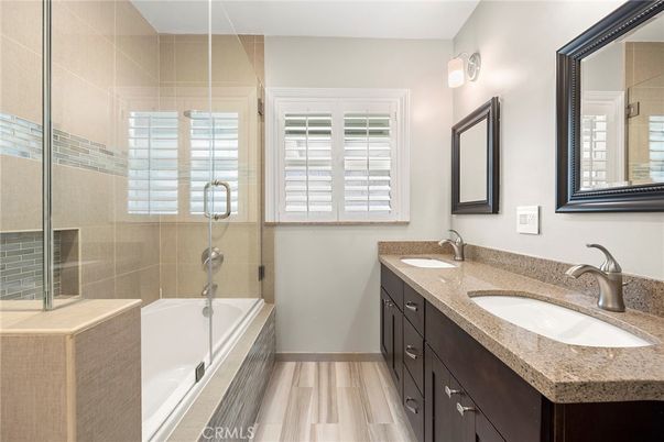 Bathroom, Dual Sink Vanities, Glass Shower, Interior, Wood Texture Flooring