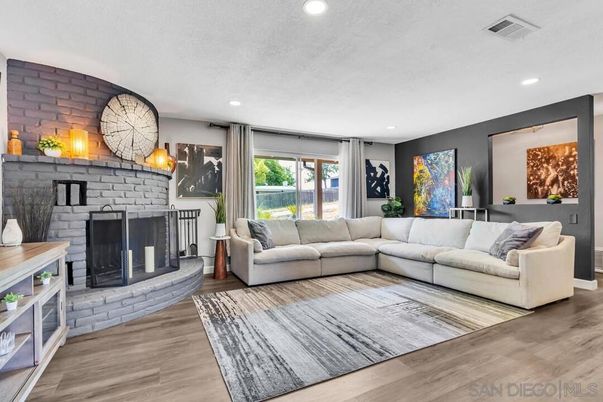Fireplace, Interior, Living room, Recessed Lighting, Stone Walls, Wood Texture Flooring