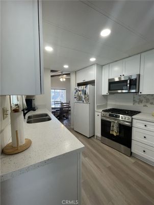 Dining room, Interior, Kitchen, Recessed Lighting, Stainless Steel Appliances, Wood Texture Flooring