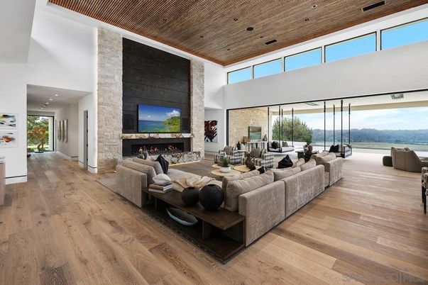 Fireplace, Interior, Living room, Recessed Lighting, Stone Walls, Water, Wooden Ceilings, Wood Texture Flooring
