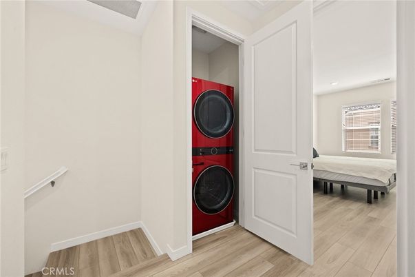 Bedroom, Interior, Recessed Lighting, Utility Closets, Washer, Wood Texture Flooring