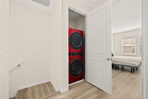 Bedroom, Interior, Recessed Lighting, Utility Closets, Washer, Wood Texture Flooring