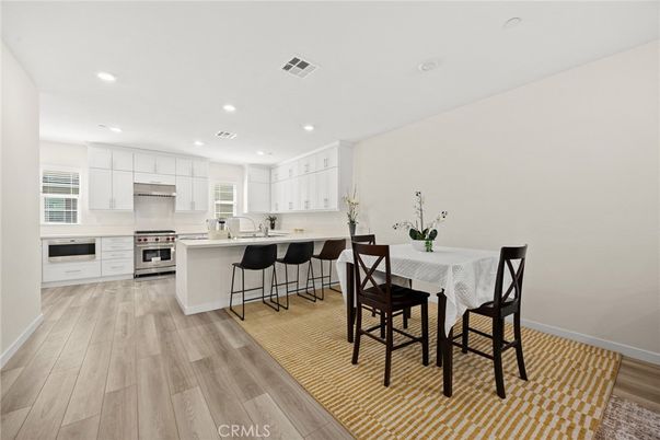 Dining room, Interior, Kitchen, Recessed Lighting, Stainless Steel Appliances, Wood Texture Flooring