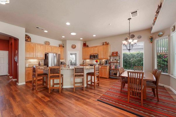Chandelier, Dining room, Interior, Kitchen, Recessed Lighting, Stainless Steel Appliances, Wood Texture Flooring