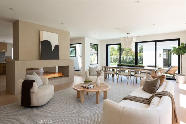 Chandelier, Dining room, Fireplace, Interior, Living room, Pendant Lights, Recessed Lighting, Wood Texture Flooring