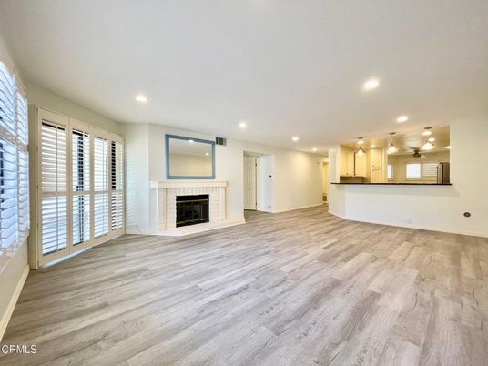 Empty room, Fireplace, Interior, Kitchen, Recessed Lighting, Wood Texture Flooring