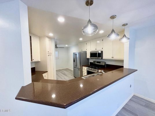 Interior, Kitchen, Pendant Lights, Recessed Lighting, Stainless Steel Appliances, Wood Texture Flooring
