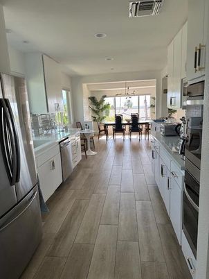 Dining room, Interior, Kitchen, Pendant Lights, Recessed Lighting, Stainless Steel Appliances, Wood Texture Flooring