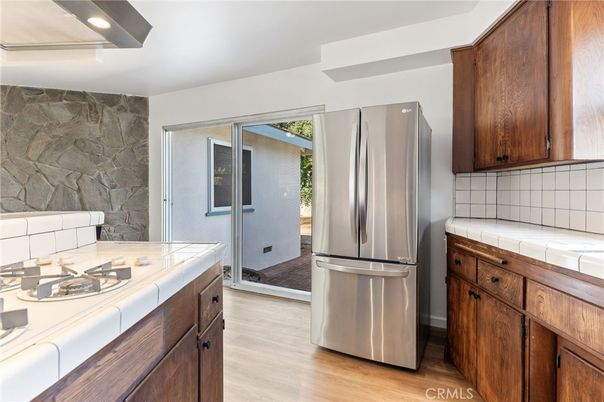 Interior, Kitchen, Recessed Lighting, Stone Walls, Tile Countertops, Wood Texture Flooring