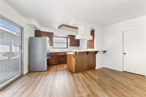 Interior, Kitchen, Recessed Lighting, Tile Countertops, Wood Texture Flooring