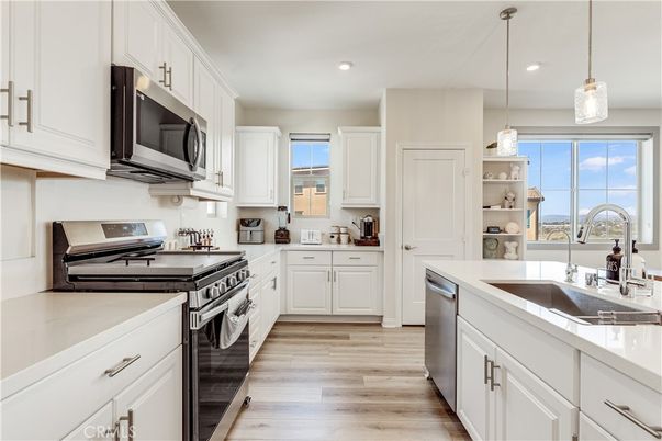 Interior, Kitchen, Pendant Lights, Recessed Lighting, Stainless Steel Appliances, Wood Texture Flooring