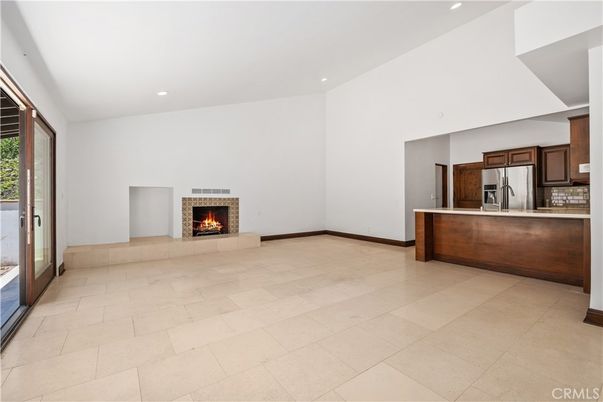 Empty room, Fireplace, Interior, Kitchen, Recessed Lighting, Stainless Steel Appliances