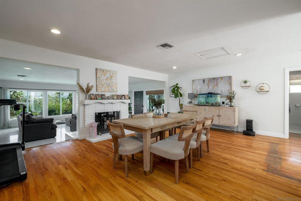 Dining room, Fireplace, Interior, Living room, Recessed Lighting, Wood Texture Flooring