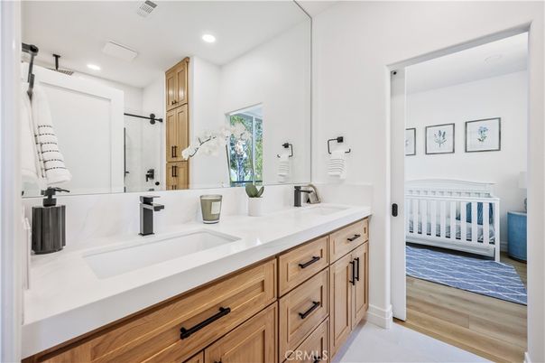 Bathroom, Dual Sink Vanities, Interior, Recessed Lighting, Wood Texture Flooring