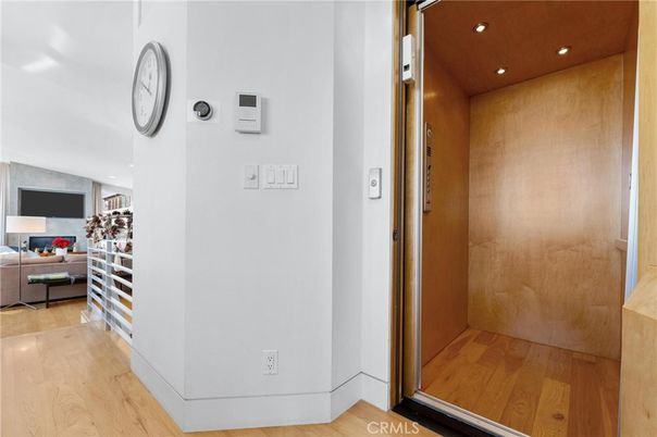 Elevator, Interior, Recessed Lighting, Wood Texture Flooring, Wooden Walls