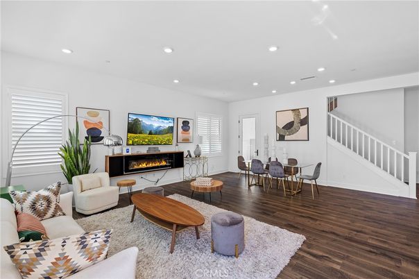 Dining room, Fireplace, Interior, Living room, Recessed Lighting, Wood Texture Flooring