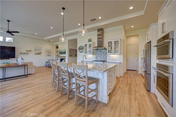 Dining room, Interior, Kitchen, Pendant Lights, Recessed Lighting, Stainless Steel Appliances, Wood Texture Flooring