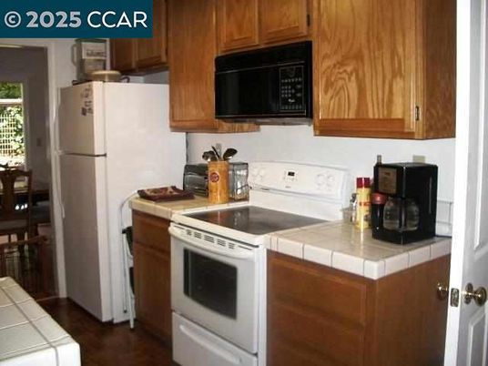 Interior, Kitchen, Tile Countertops, Wood Texture Flooring