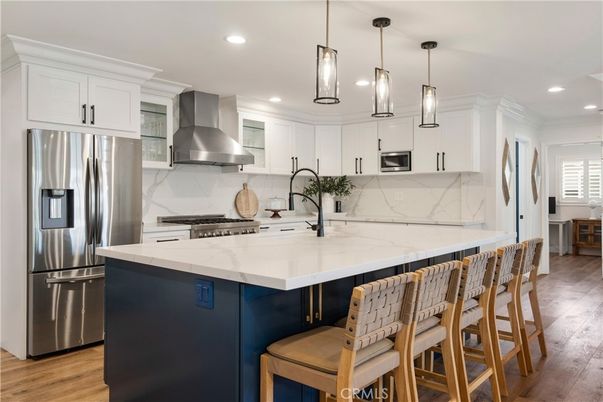 Interior, Kitchen, Marble Walls, Pendant Lights, Recessed Lighting, Stainless Steel Appliances, Wood Texture Flooring