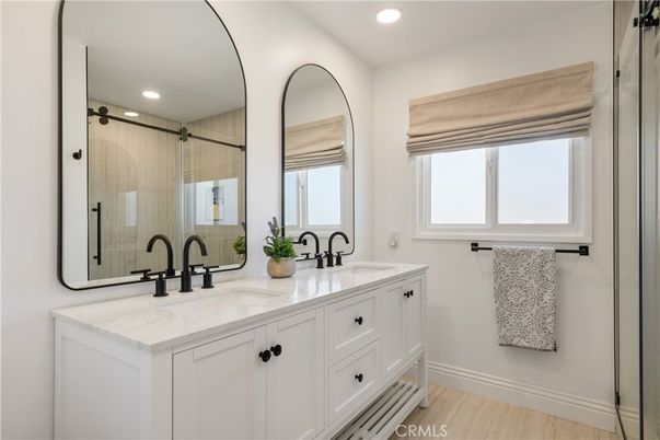 Bathroom, Dual Sink Vanities, Glass Shower, Interior, Recessed Lighting, Wood Texture Flooring