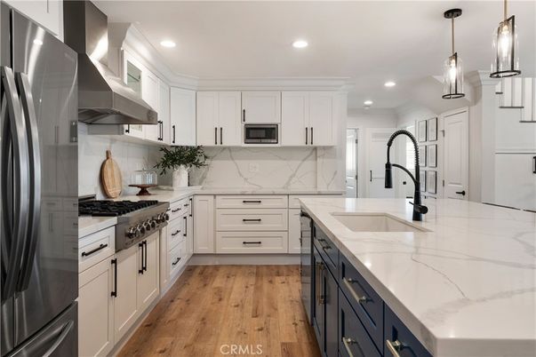 Interior, Kitchen, Marble Walls, Pendant Lights, Recessed Lighting, Stainless Steel Appliances, Wood Texture Flooring