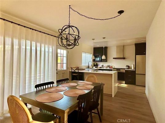 Chandelier, Dining room, Interior, Kitchen, Pendant Lights, Recessed Lighting, Stainless Steel Appliances, Wood Texture Flooring