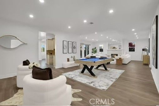 Billiard Table, Fireplace, Game Room, Interior, Living room, Pendant Lights, Recessed Lighting, Wood Texture Flooring