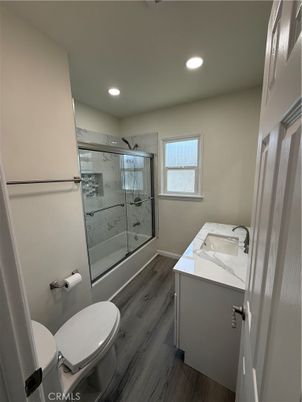 Bathroom, Glass Shower, Interior, Marble Walls, Recessed Lighting, Wood Texture Flooring