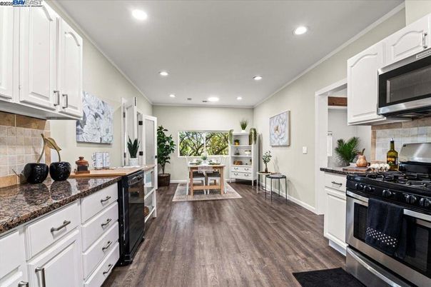 Dining room, Interior, Kitchen, Recessed Lighting, Stainless Steel Appliances, Wood Texture Flooring
