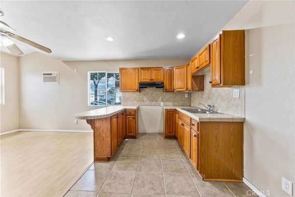 Interior, Kitchen, Recessed Lighting, Tile Countertops, Wood Texture Flooring