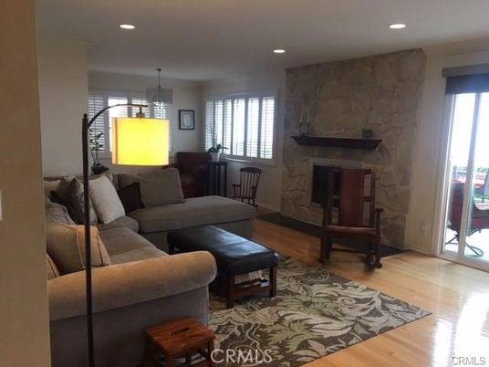 Chandelier, Fireplace, Interior, Living room, Marble Walls, Pendant Lights, Recessed Lighting, Wood Texture Flooring
