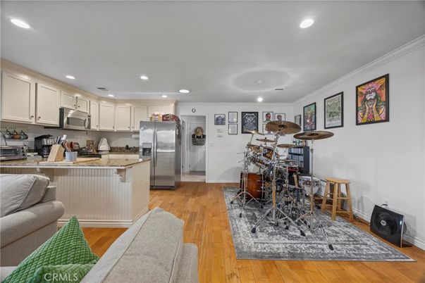 Dining room, Interior, Kitchen, Recessed Lighting, Stainless Steel Appliances, Wood Texture Flooring