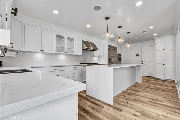 Interior, Kitchen, Marble Walls, Pendant Lights, Recessed Lighting, Stainless Steel Appliances, Wood Texture Flooring