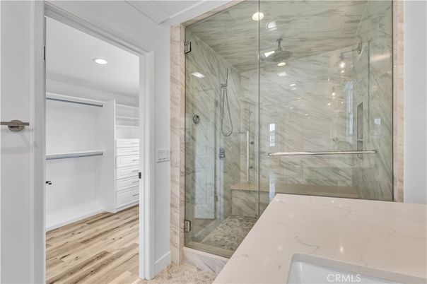 Bathroom, Glass Shower, Interior, Marble Walls, Recessed Lighting, Wood Texture Flooring