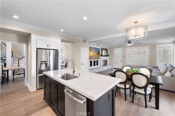 Dining room, Fireplace, Interior, Kitchen, Living room, Recessed Lighting, Stainless Steel Appliances, Wood Texture Flooring