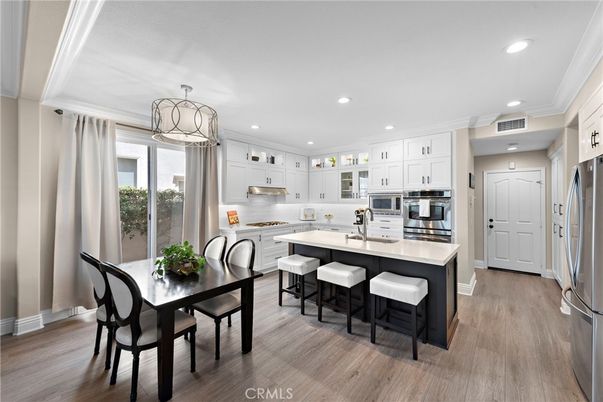 Dining room, Interior, Kitchen, Pendant Lights, Recessed Lighting, Stainless Steel Appliances, Wood Texture Flooring