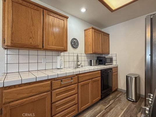 Interior, Kitchen, Recessed Lighting, Tile Countertops, Wood Texture Flooring