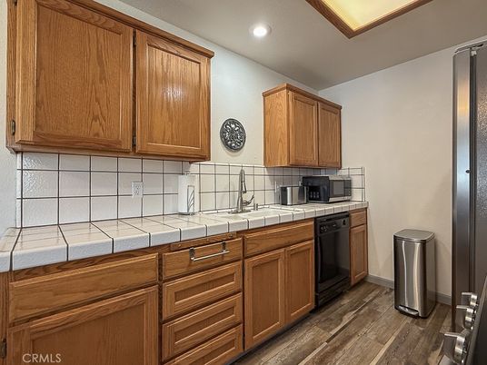 Interior, Kitchen, Recessed Lighting, Tile Countertops, Wood Texture Flooring