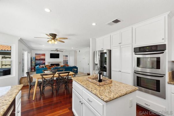 Dining room, Interior, Kitchen, Recessed Lighting, Stainless Steel Appliances, Wood Texture Flooring