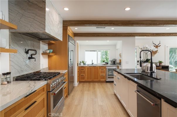 Interior, Kitchen, Marble Walls, Recessed Lighting, Stainless Steel Appliances, Wood Texture Flooring