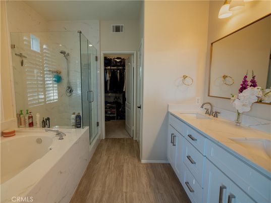Bathroom, Dual Sink Vanities, Glass Shower, Interior, Marble Walls, Wood Texture Flooring