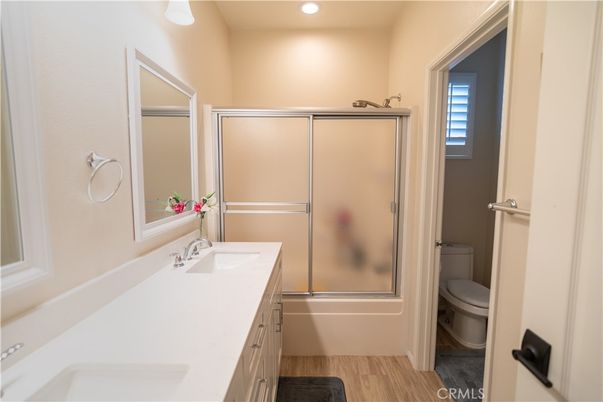 Bathroom, Dual Sink Vanities, Glass Shower, Interior, Recessed Lighting, Wood Texture Flooring